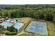 Aerial view of the community pool and tennis courts, perfect for recreation and relaxation in this neighborhood at 11909 Cupworth Ct, Huntersville, NC 28078