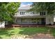 Exterior view of screened porch and backyard at 11909 Cupworth Ct, Huntersville, NC 28078