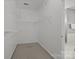 Walk-in closet featuring shelving and a carpeted floor at 11909 Cupworth Ct, Huntersville, NC 28078