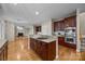 Open kitchen layout with granite counters, stainless steel appliances and access to the living room at 11909 Cupworth Ct, Huntersville, NC 28078