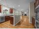 Open kitchen with granite countertops, stainless appliances, and views to the living room and backyard at 11909 Cupworth Ct, Huntersville, NC 28078