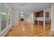 Spacious room showcasing an open floor plan with beautiful hardwood flooring and lots of natural light at 11909 Cupworth Ct, Huntersville, NC 28078
