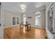 Well-lit office with hardwood floors, decorative ceiling tiles, and large windows, perfect for a productive workspace at 11909 Cupworth Ct, Huntersville, NC 28078