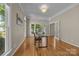 Bright office with hardwood floors, large windows, and French doors, offering a professional work environment at 11909 Cupworth Ct, Huntersville, NC 28078