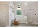Bright bathroom featuring soaking tub and shower with glass door at 12900 Westmoreland Rd, Huntersville, NC 28078
