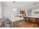 The kitchen boasts stainless steel appliances, a large island, and a modern design at 12900 Westmoreland Rd, Huntersville, NC 28078