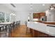A kitchen with stainless steel appliances, a large island, and an adjacent dining area at 12900 Westmoreland Rd, Huntersville, NC 28078