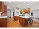 Spacious kitchen with wooden cabinets, white countertops and hardwood floors at 12900 Westmoreland Rd, Huntersville, NC 28078