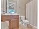 Bathroom features a wood vanity and shower with curtain at 13056 Long Common Pkwy, Huntersville, NC 28078