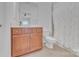 Bathroom features a vanity with storage and a toilet with shower and curtains at 13056 Long Common Pkwy, Huntersville, NC 28078
