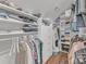 Functional walk-in closet with built-in storage, shelves, and hanging space at 13056 Long Common Pkwy, Huntersville, NC 28078