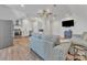 Open living space featuring stainless appliances, kitchen and comfortable gray sofa seating at 13056 Long Common Pkwy, Huntersville, NC 28078