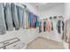 Well-organized walk-in closet with shelving and clothing racks for easy storage and access at 13056 Long Common Pkwy, Huntersville, NC 28078