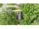 Overhead shot displays a house surrounded by trees providing privacy in a green and natural setting at 13446 Idlefield Ln, Matthews, NC 28105