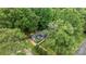 Aerial view of a home surrounded by lush greenery offering a serene and private setting at 13446 Idlefield Ln, Matthews, NC 28105