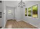 Bright dining area with hardwood floors, natural light, and contemporary pendant lighting at 13446 Idlefield Ln, Matthews, NC 28105