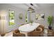 Contemporary dining room featuring a marble table, modern lighting, and large windows with natural light at 13446 Idlefield Ln, Matthews, NC 28105