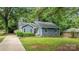 Charming home with a well-kept lawn, tasteful landscaping, and inviting curb appeal at 13446 Idlefield Ln, Matthews, NC 28105