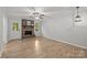 Bright living room features a charming brick fireplace at 13446 Idlefield Ln, Matthews, NC 28105