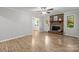 Spacious living room featuring a decorative brick fireplace at 13446 Idlefield Ln, Matthews, NC 28105