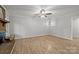 Open living room featuring a brick fireplace at 13446 Idlefield Ln, Matthews, NC 28105