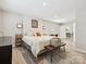 A spacious bedroom with an ensuite, a walk in closet, and an inviting rug at 136 Gable Rd, Mooresville, NC 28115