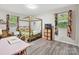 Eclectic bedroom with a four-poster bed, colorful accents, and ample lighting at 136 Gable Rd, Mooresville, NC 28115