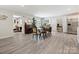 Open concept dining area with vinyl floors and natural light at 136 Gable Rd, Mooresville, NC 28115