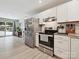 Bright kitchen with stainless steel refrigerator and stove adjacent to the living area at 136 Gable Rd, Mooresville, NC 28115