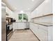 Bright kitchen featuring stainless steel appliances and white cabinets with a window at 136 Gable Rd, Mooresville, NC 28115
