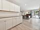 Kitchen cabinets overlooking an open dining room with access to the backyard at 136 Gable Rd, Mooresville, NC 28115