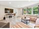 Cozy living room featuring a fireplace, large windows and ample seating at 136 Gable Rd, Mooresville, NC 28115