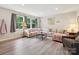 Bright living room with large windows, stylish furniture and contemporary decor at 136 Gable Rd, Mooresville, NC 28115