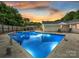 Stunning outdoor pool with vibrant lighting and a comfortable seating area at 136 Gable Rd, Mooresville, NC 28115