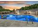 Inviting backyard pool with a beautiful sunset and comfortable lounge seating at 136 Gable Rd, Mooresville, NC 28115