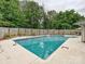 Sparkling in-ground pool in a fenced backyard offers a refreshing oasis for relaxation and outdoor enjoyment at 136 Gable Rd, Mooresville, NC 28115