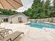 Beautiful outdoor pool area with lounge chairs and a white brick pool house at 136 Gable Rd, Mooresville, NC 28115