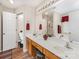 Bathroom with a double vanity, separate shower, and tub at 13830 Riding Hill Ave, Charlotte, NC 28213