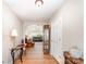 Inviting foyer with wood flooring and elegant decor leading to the living area at 13830 Riding Hill Ave, Charlotte, NC 28213