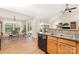 Open kitchen with a breakfast area, including a dishwasher and dining table at 13830 Riding Hill Ave, Charlotte, NC 28213