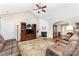 Spacious living room featuring a vaulted ceiling and a cozy fireplace at 13830 Riding Hill Ave, Charlotte, NC 28213
