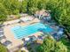 Aerial view highlighting the community pool, pool, cabanas, clubhouse and playground at 15001 Rosemary Way Dr, Huntersville, NC 28078