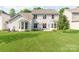 Large backyard with lush green lawn perfect for outdoor activities and relaxation at 15001 Rosemary Way Dr, Huntersville, NC 28078