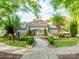 View of the Centennial community clubhouse surrounded by lush greenery at 15001 Rosemary Way Dr, Huntersville, NC 28078