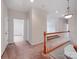 The upstairs hallway leads to various bedrooms and features carpeted floors at 15001 Rosemary Way Dr, Huntersville, NC 28078