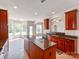 Spacious kitchen features granite countertops, stainless steel appliances, and lots of natural light at 15001 Rosemary Way Dr, Huntersville, NC 28078