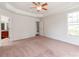 Main bedroom features trey ceiling, carpet, lots of natural light and an adjoining bathroom at 15001 Rosemary Way Dr, Huntersville, NC 28078