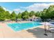 The community pool with clubhouse offers a cool, relaxing oasis for residents at 15001 Rosemary Way Dr, Huntersville, NC 28078
