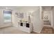 Bedroom interior with a window, decor, carpeting and white shelving at 15031 Milo Ln, Charlotte, NC 28278