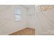 Bright walk-in closet with white shelving and carpeting throughout at 15031 Milo Ln, Charlotte, NC 28278